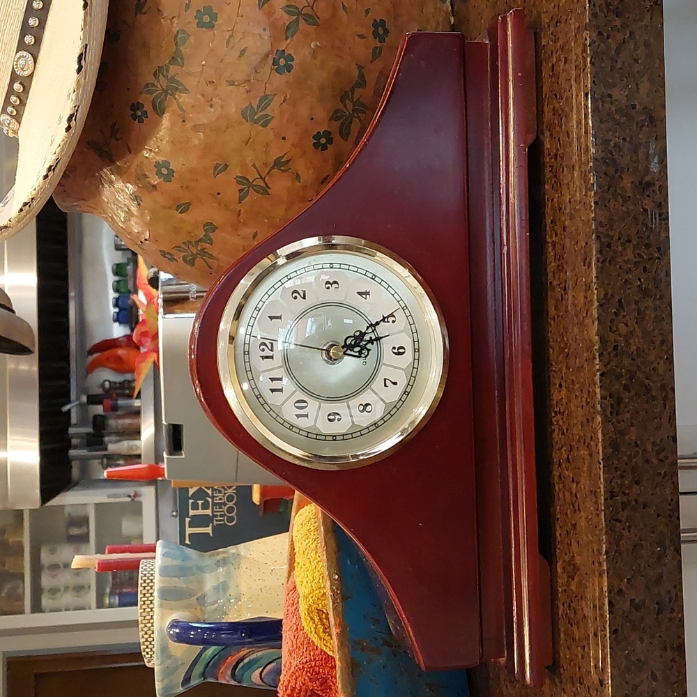 Clock with hidden compartment